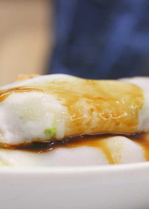 Soy sauce pouring on Steamed Vermicelli Roll in Chinese restaurant
